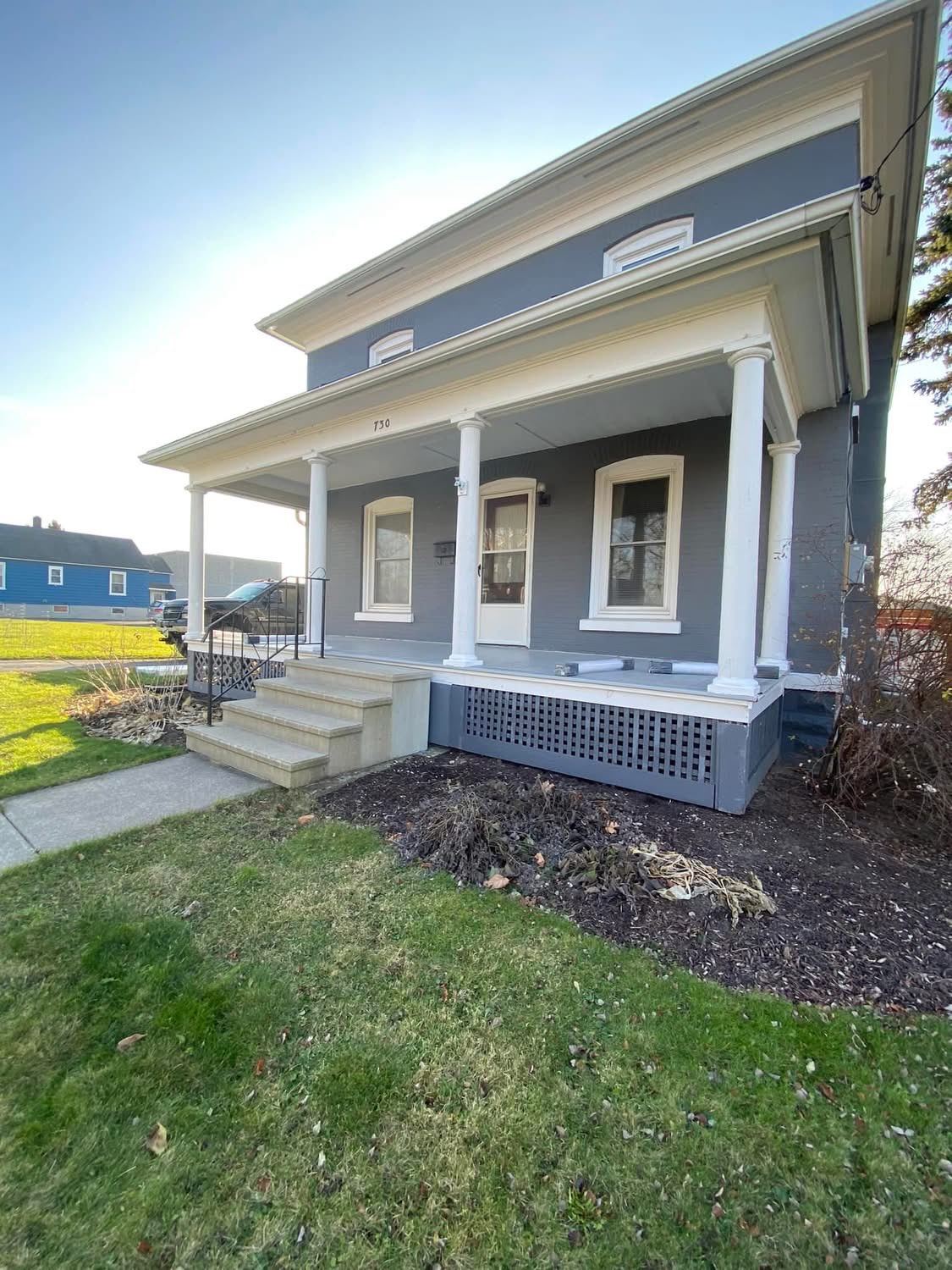 Historic home exterior renovation with covered porch