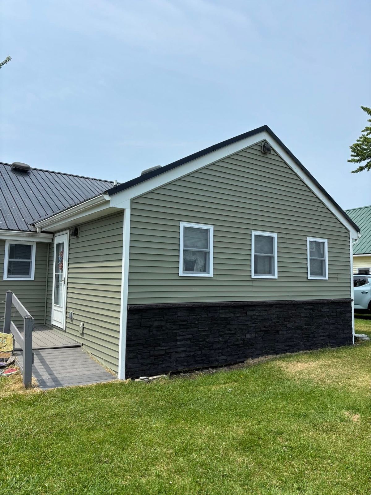 Exterior siding with stone veneer